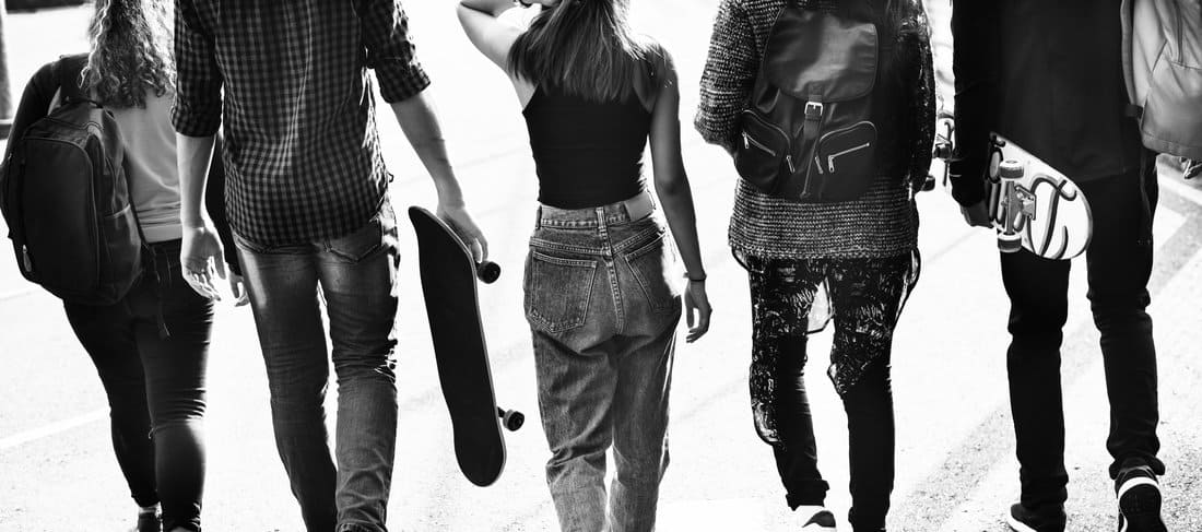 teenagers walking black and white